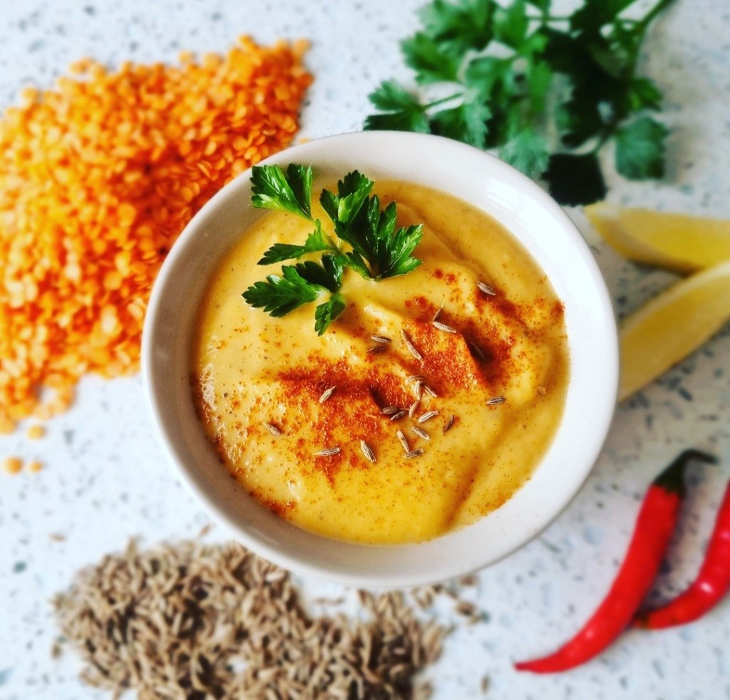 delicious, thick yellow lentil soup with a light sprinkle of spice on top and finished off with fresh coriander